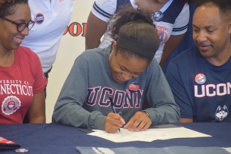 Crystal Dangerfield, senior, excitedly signs her commitment to UCONN