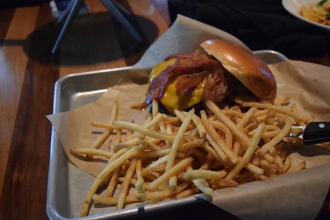 A classic, yet signature dish of BJ’s: A cheese burger topped with delicious apple wood smoked twist, bacon accompanied by seasoned thin fries.