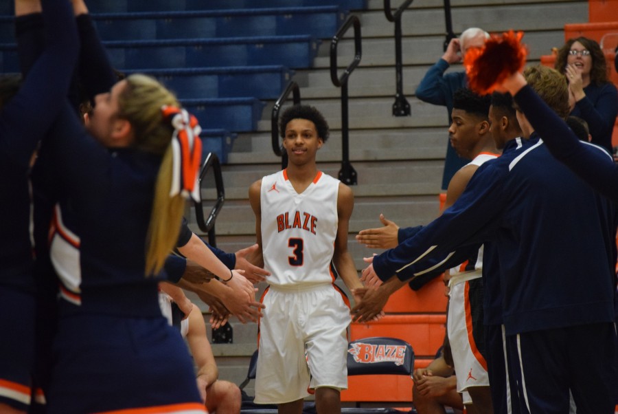 Photo by Jared Robinson
Sims walks out for the starting lineups in the Region 4A quarterfinals

