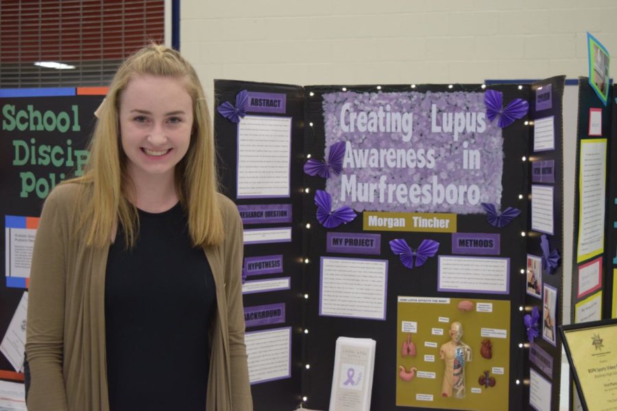 Morgan Tinchers Capstone Project: How Genes and Gender Affect a Potential Cure for Lupus centered on how genes and gender affect a potential cure for lupus. She concluded that despite medical advancements and extensive research, lupus is still largely not understood. For Morgans project she partnered with the Rutherford County Chamber of Commerce to spread awareness at their annual womens conference. She created a pamphlet with information about lupus, a personal testimonial, and resources for those affected. Morgan spoke with several women about their own battles with lupus and answered many questions. Morgan was inspired to do this project from her own lupus diagnosis, and she hopes to spread awareness throughout Murfreesboro. 
 