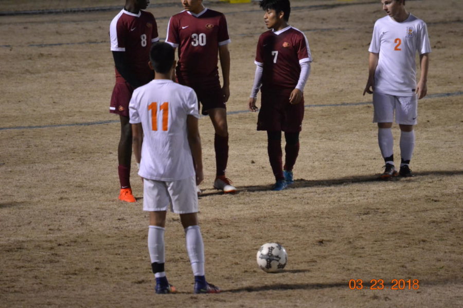 Senior Kobe Srisaroth lines up for a free kick in front of the goal.