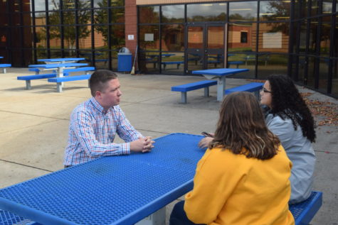 Matthew Hurts speak to the Blackman Voice staff in the courtyard.