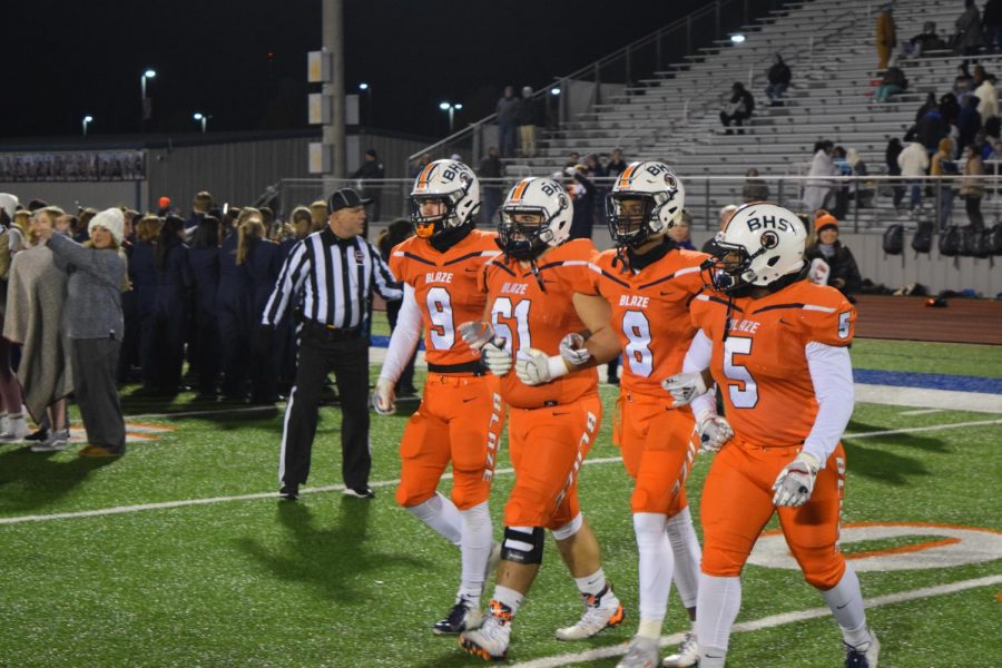 Blackman players head to mid-field for opening coin toss.