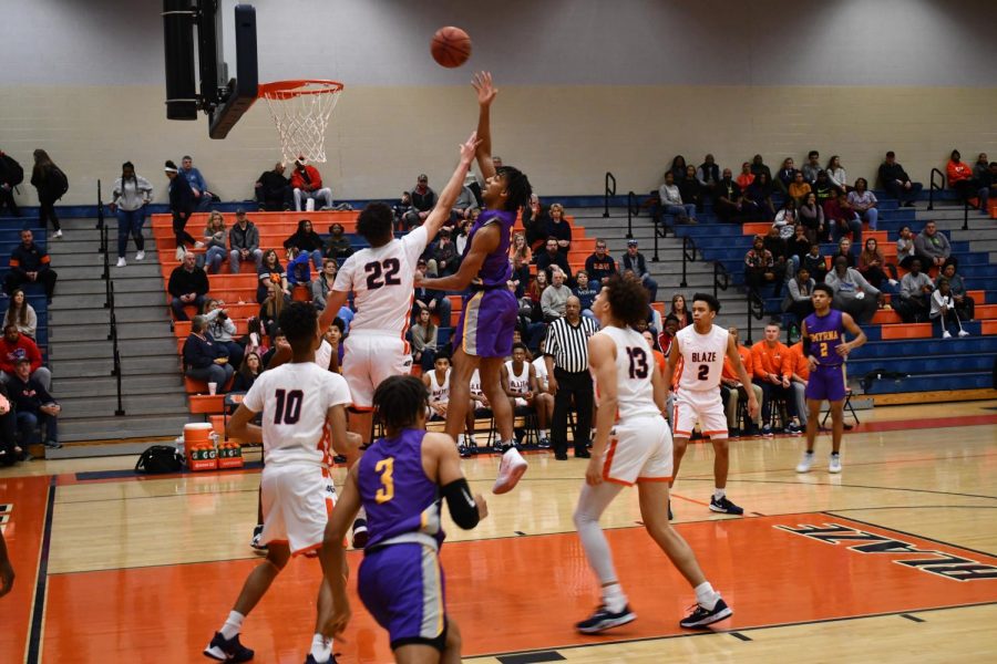 Jalen Stayton attempts to block a shot.