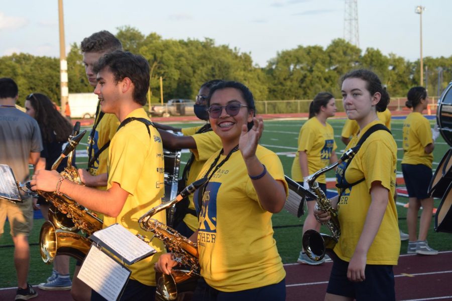 The band helps hype the team before the game starts.