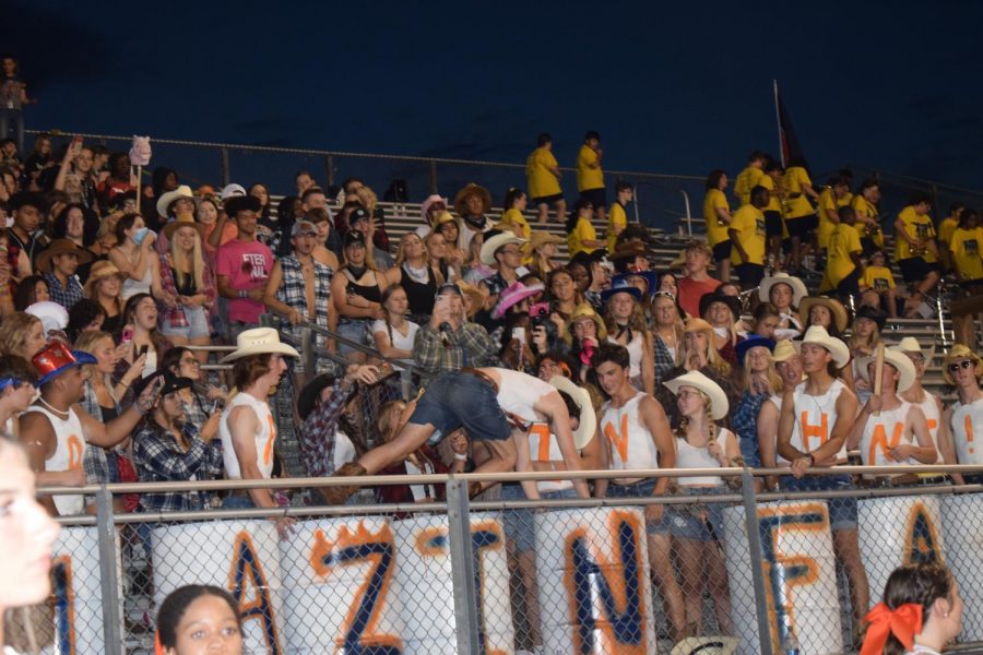 Student does pushup challenge to show team support.