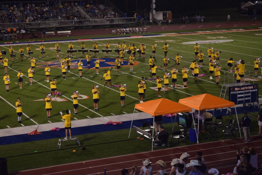 The Blackman Blaze band performs "Come Together", a Beatles medley, for the half-time show. 