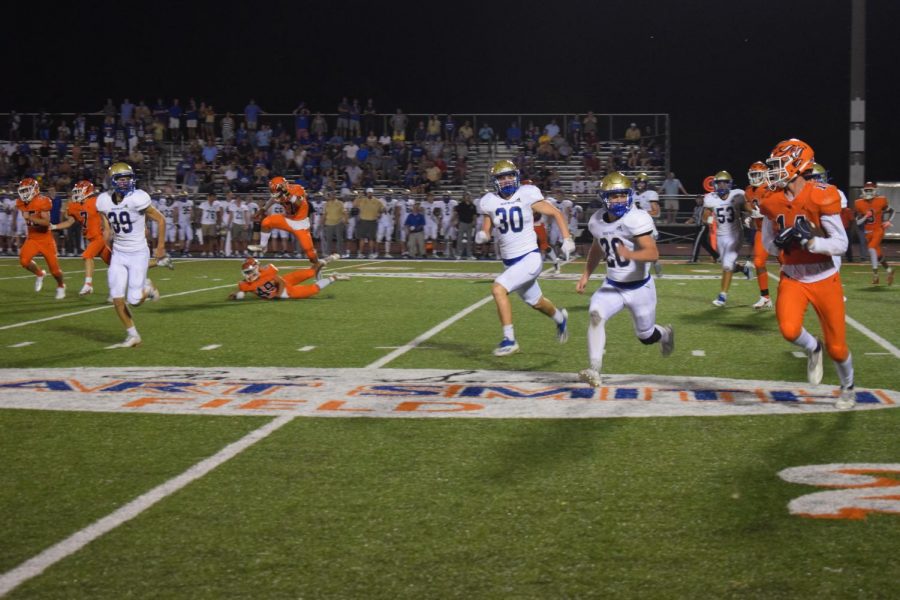 Taken during the first home football game against Brentwood. Number 14 running the ball past 20 yard line to get a touch down. 