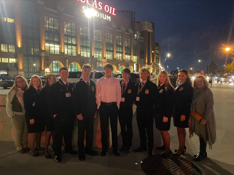 FFA officers smile for a picture in front of Lucas Oil Stadium at the National Covention. 
