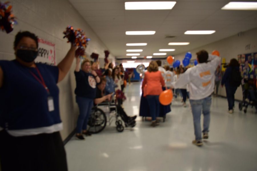 Celebration and support of the team is seen throughout the school hallways.