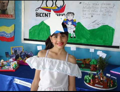 School events were very popular in Venezuela. 
At most of these events, we danced to Llanera music, which is typical music from Venezuela. This music is distinctive for its use of the harp, maracas, and a small guitar called Cuatro. 
The typical clothing to do this dance was a Llanera skirt, which is a long skirt, and a faralao shirt (just like shown in the picture)