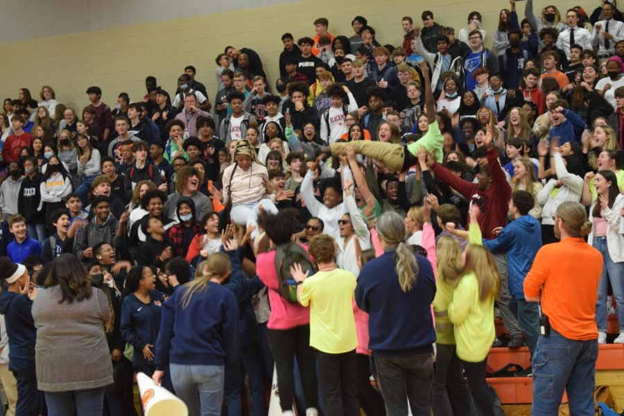 The Freshmen crowd surf one of their classmates during the March 9th pep rally.