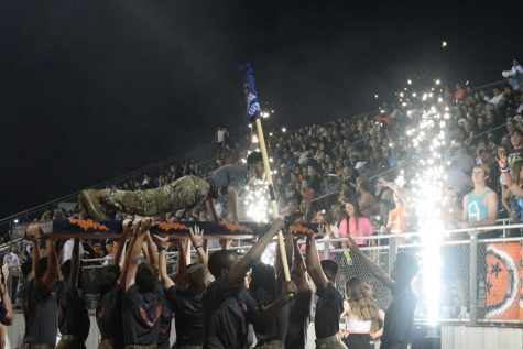 Blackman JROTC celebrating Blackmans touchdown by doing pushups for the student section.