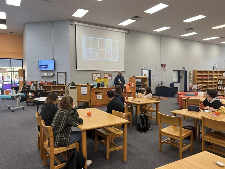 Scott Reintgen talking to students at the library.