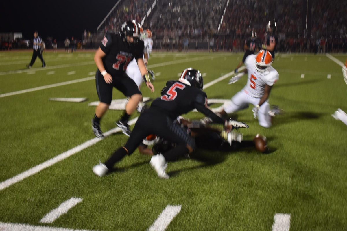 Blackman forcing and recovering a fumble.