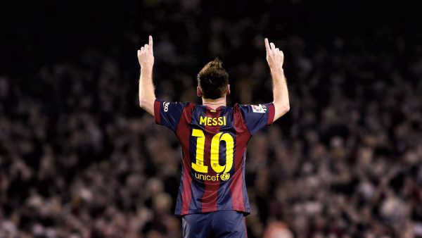 Messi pointing at the sky.