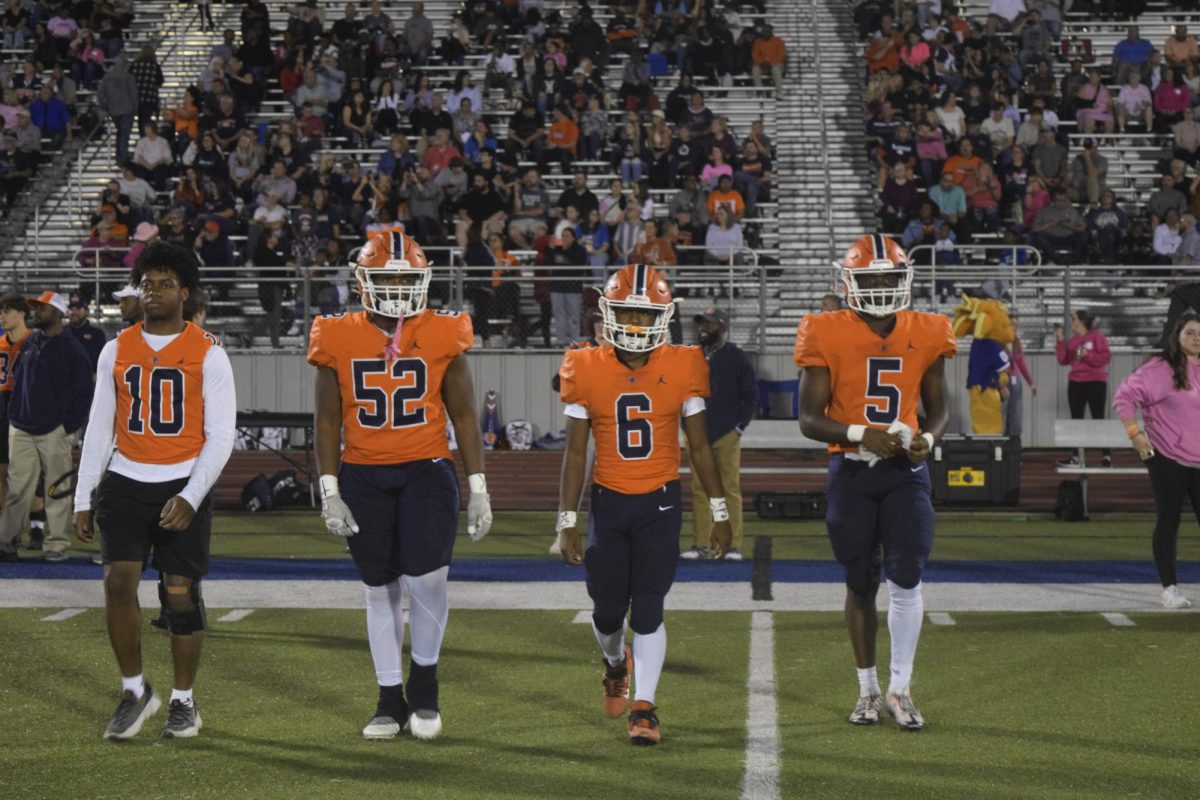 Blackman players walk onto field for coin toss