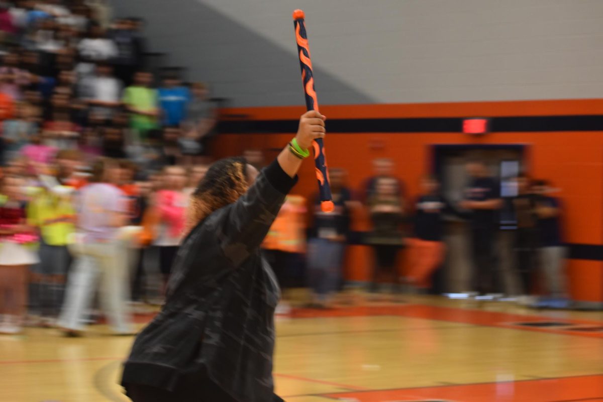 Marciana Johnson receiving the spirit stick for the seniors. 