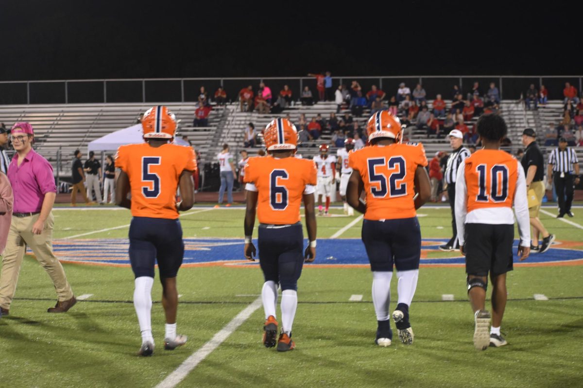 Blackman going to mid field for the coin toss
