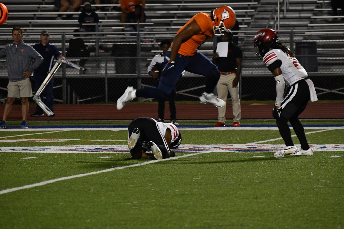 Blackman player jumps over Pure Academy player 