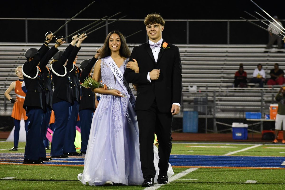 Sofia Williams sophomore homecoming attendant escorted by Deacon Flowers 