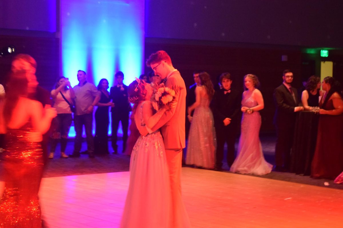 Prom Queen Alyssa McBroom dancing with date.