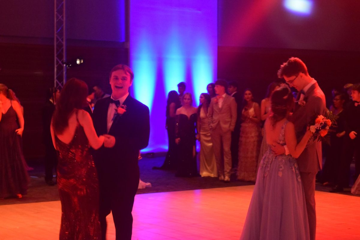 Prom King and Queen dancing with their dates.
