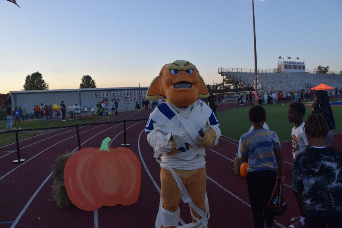 Blaze mascot taking pictures 