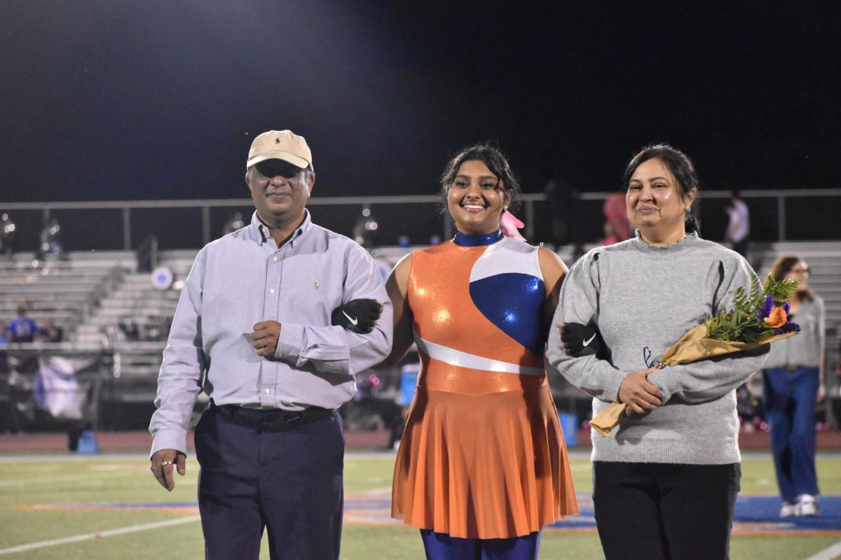 Senior Aesha Shah with family