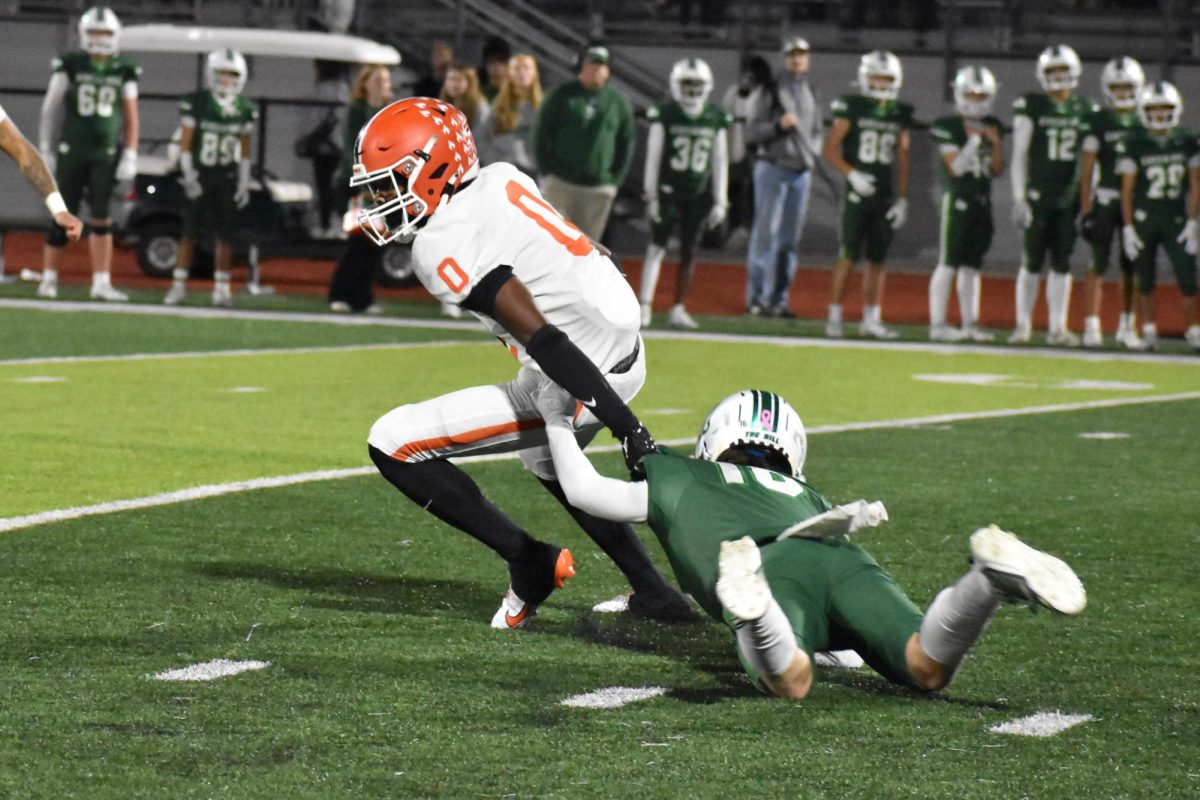 Jayden Guy breaking a tackle