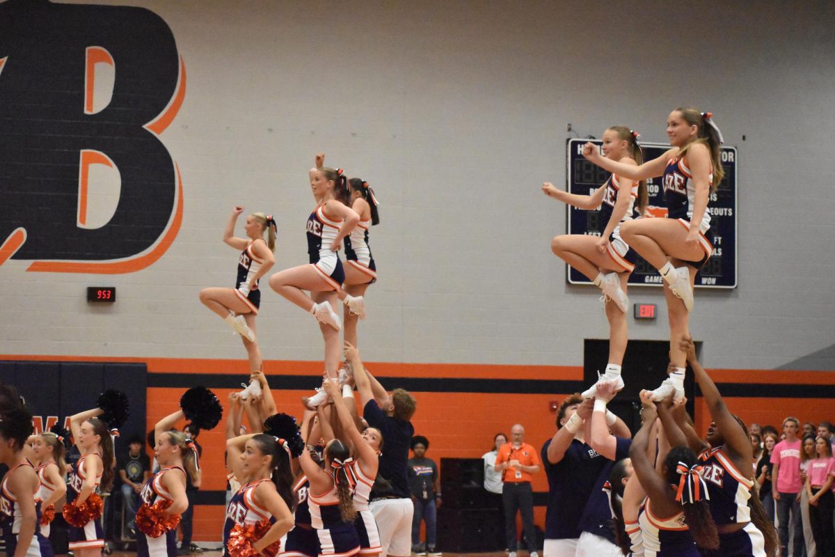 5 cheerleaders in air