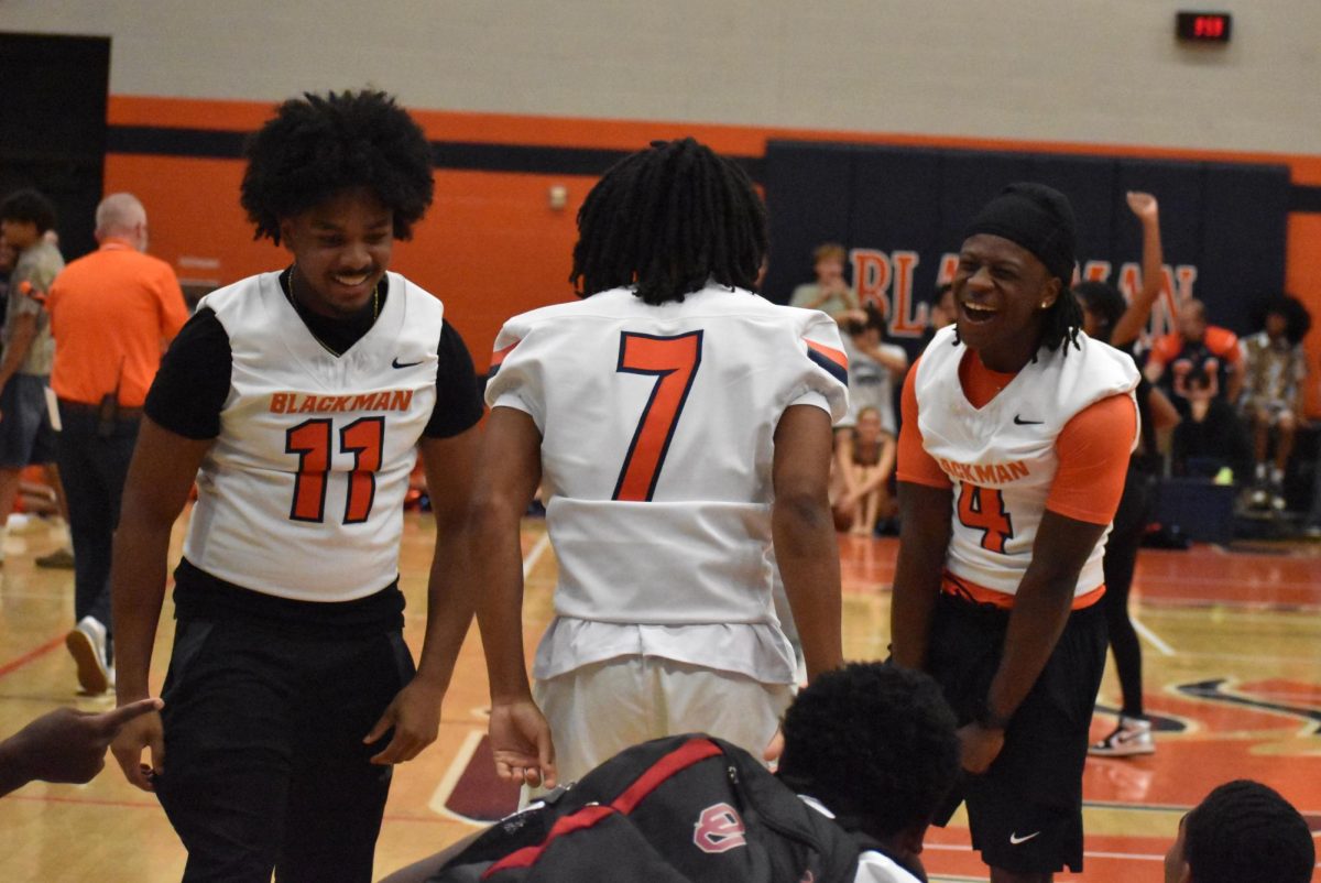 Makari Abernathy, Kari Dixon, and Jaden Lark celebrating the seniors win in the class games.