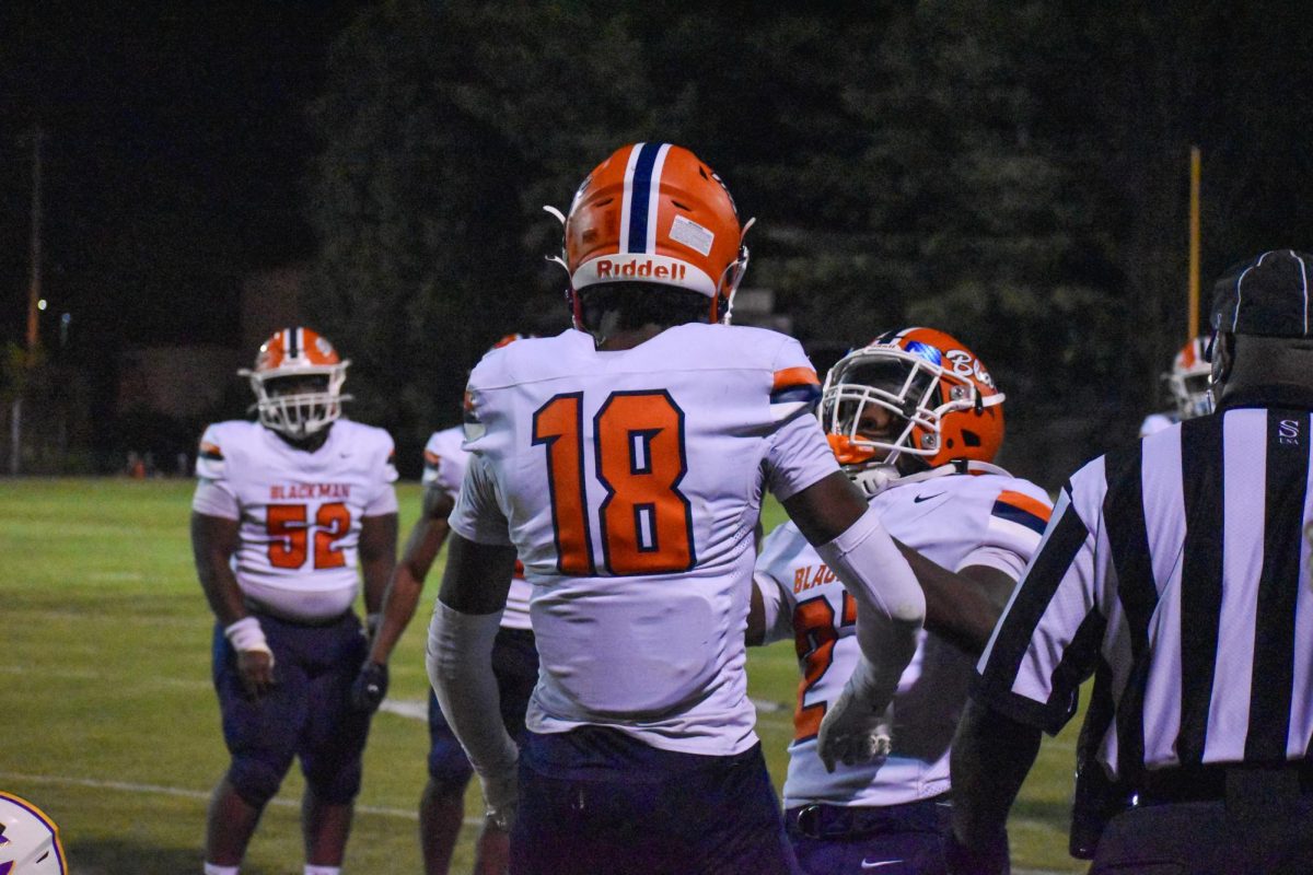 Seniors AD Davis and Jaylen Dowell celebrating after a stop