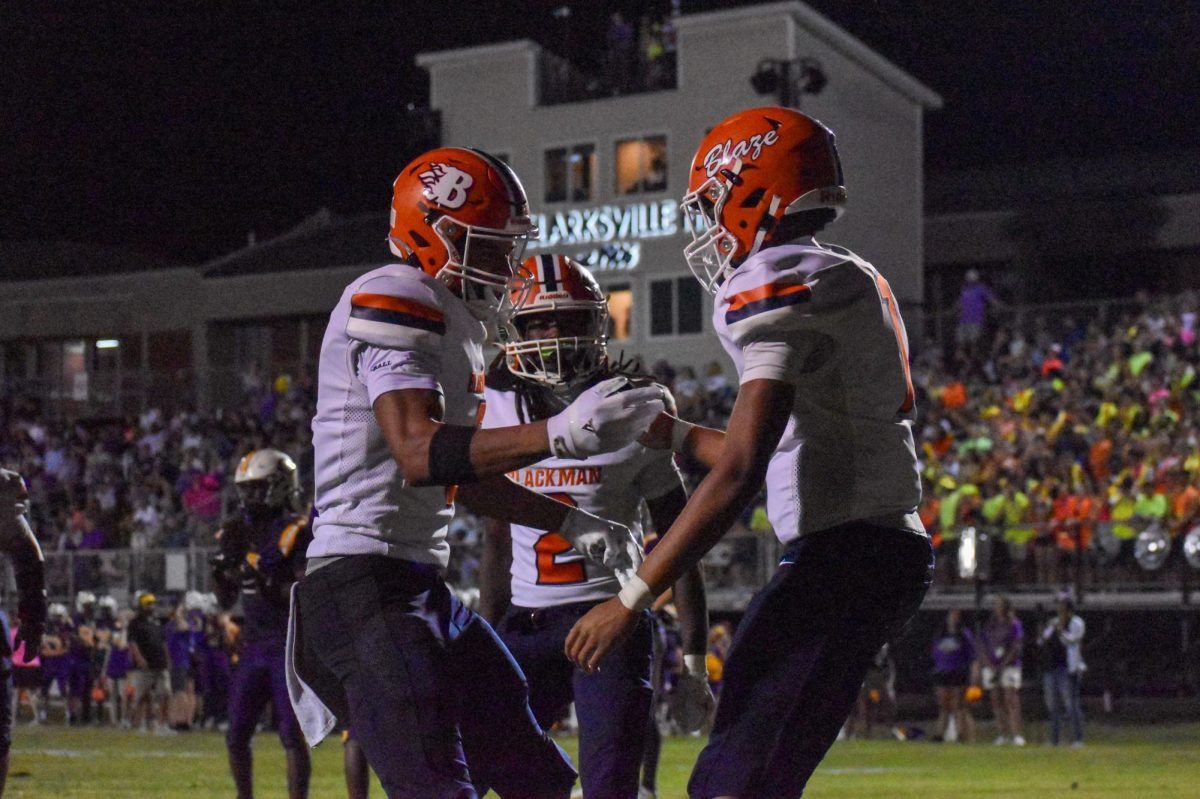 junior Brylan Odour and senior Jaevion Elliot celebrating a touchdown 