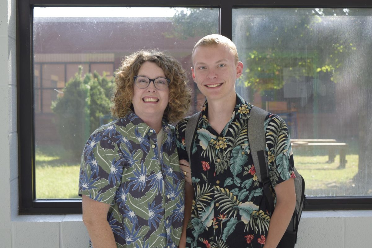 Senior Stockton Smart and Mrs. Bunner posing for Hawaiian day. 