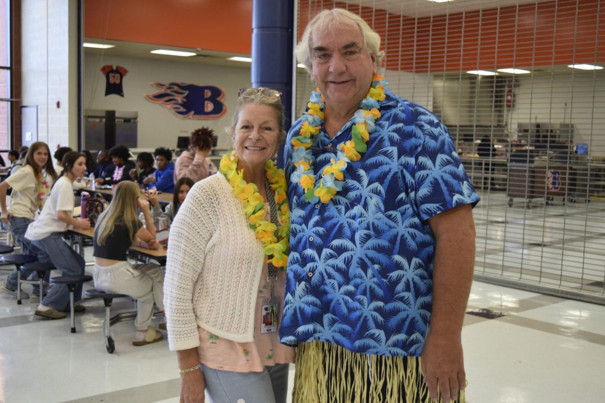 Mr. Rehnborg and Mrs. Stockard dressed up for Hawaiian day, 