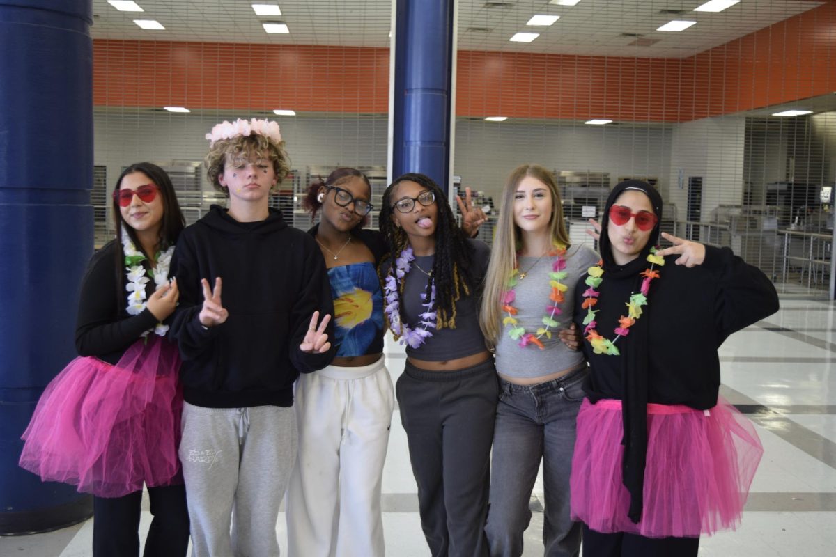 Students posing for Hawaiian day in the cafeteria. 