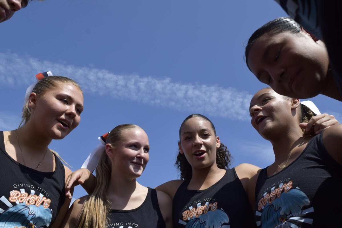 Sofia Williams and other students huddling for Blaze Bash kickball.