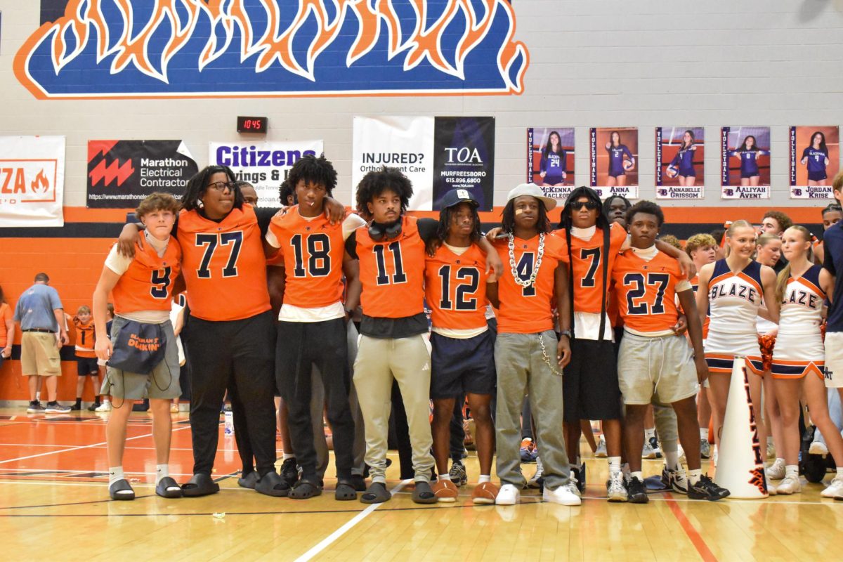 Senior football players during the Alma mater 