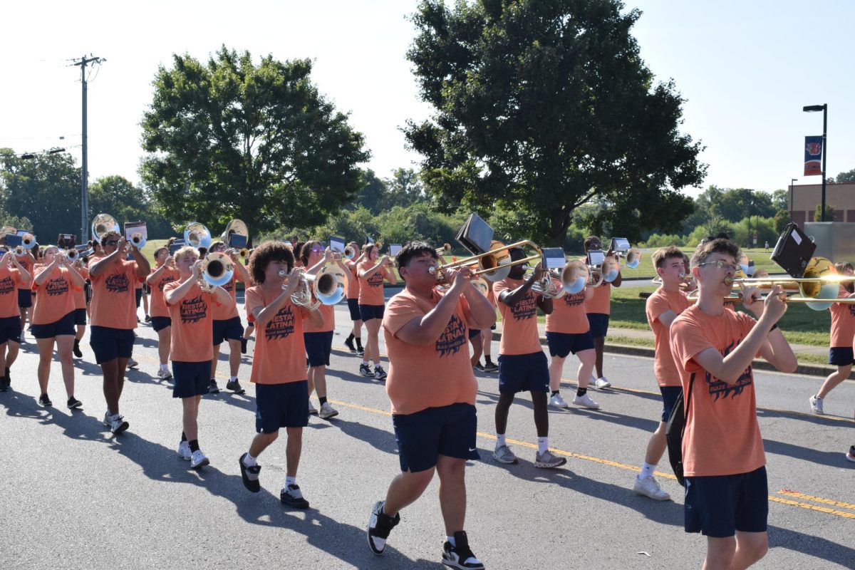 Wind Ensemble section of band marching in the parade