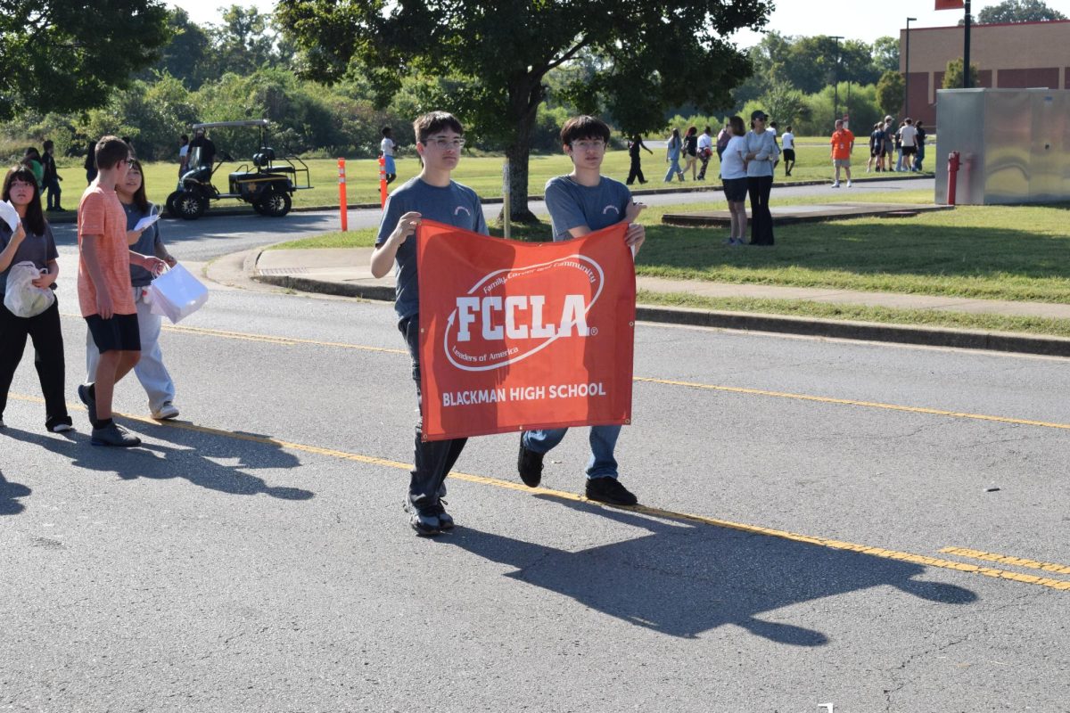 FCCLA holding up a sign