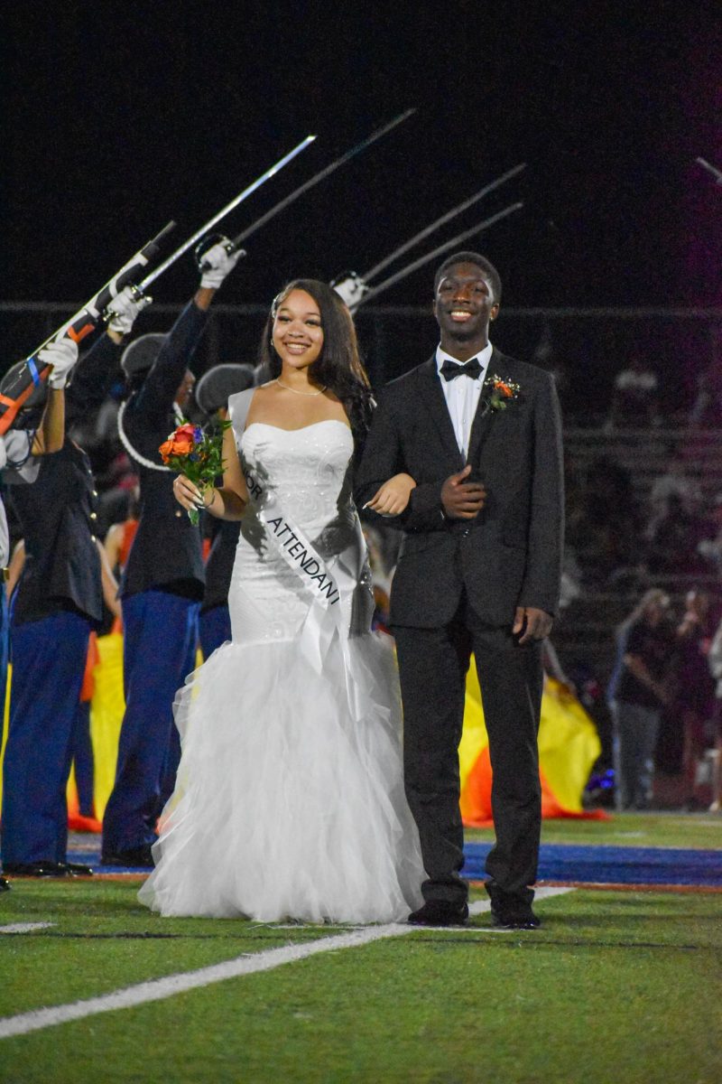 Tavaria Davis being escorted by TJ Irvine