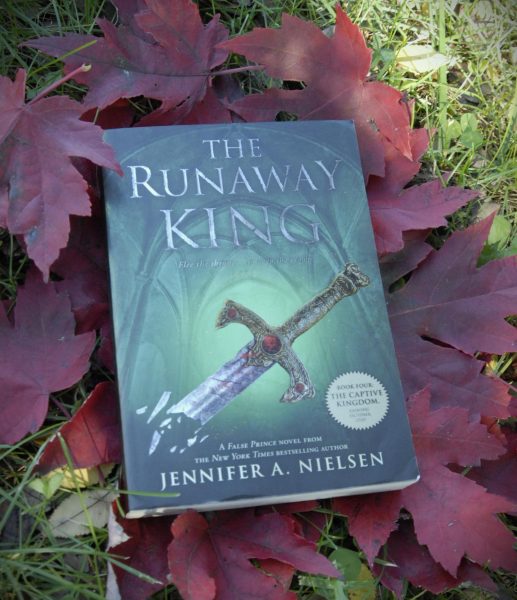 A book titled  "The Runaway King" by Jennifer A. Nielsen 